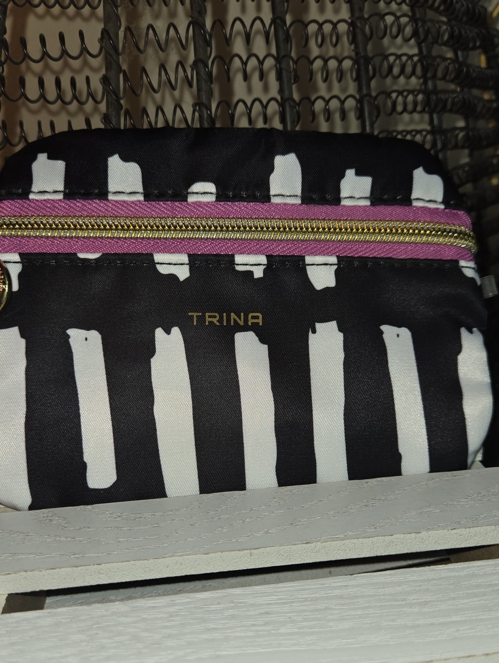 Ina Black and White Striped Cosmetic Pouch with Pink Trim and Gold Zipper